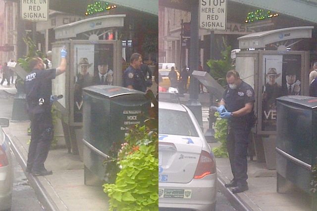 A tipster sent in these pics of an officer dusting the fake ads this afternoon.